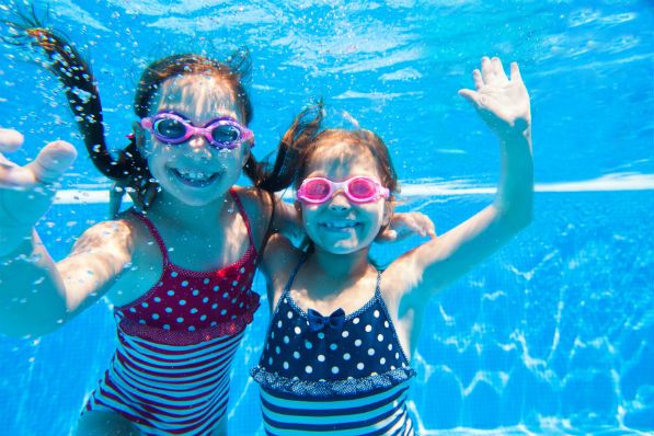 kids swimming in a pool